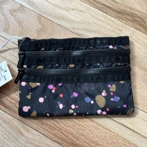 LeSportsac 3-zip Cosmetic Black Pebbles and Hearts print